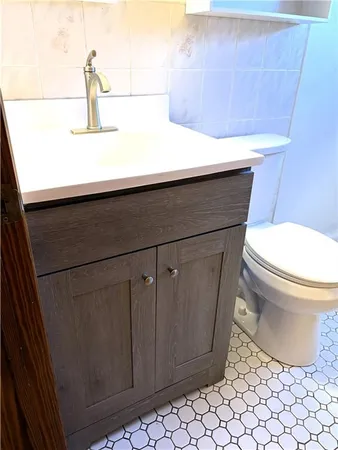 a bathroom with a toilet and a sink
