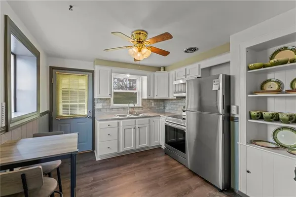 a kitchen with a refrigerator a sink and dishwasher