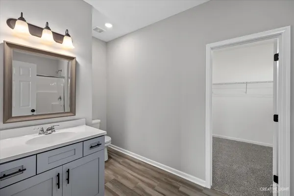 a bathroom with a sink a vanity and a mirror
