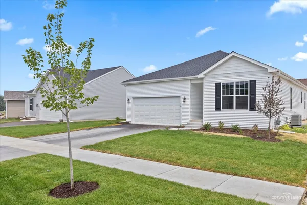 a house that has a yard in front of it