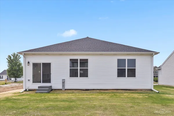 a house that has garden in front of it