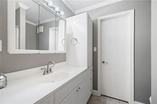 a bathroom with a sink and mirror