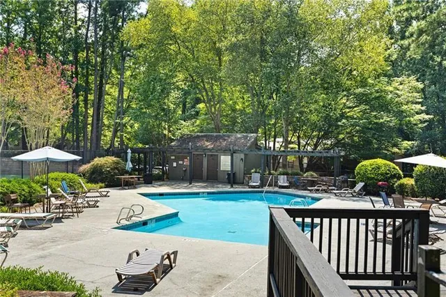 a view of a backyard with sitting area and furniture