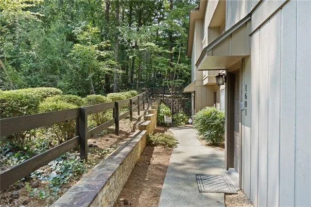 a view of a pathway of a house with wooden floor