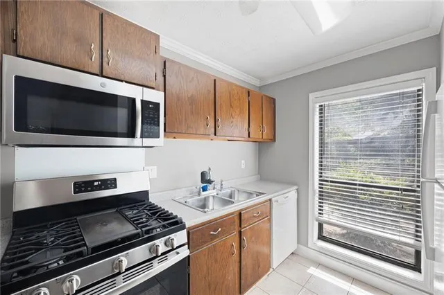 a kitchen with a stove and a microwave