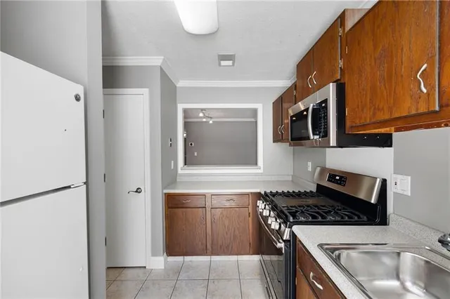 a kitchen with a stove and a microwave