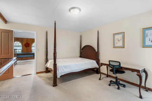 a living room with furniture a piano and a window