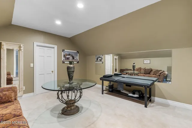 a bedroom with a bed and a dresser in it