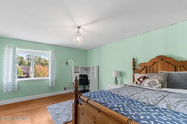 a bathroom with a sink a mirror and a vanity