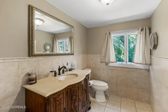 a view of house with outdoor space and car parked