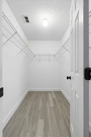 a view of a room with racks on the wall