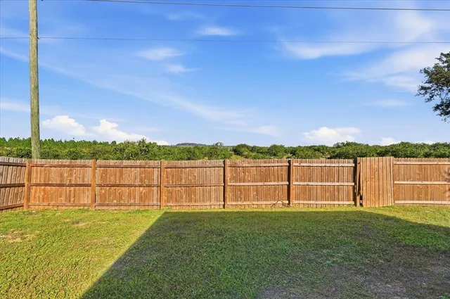 a view of a backyard with cabin