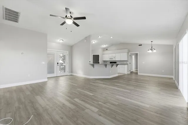 a view of kitchen with cabinets and wooden floor
