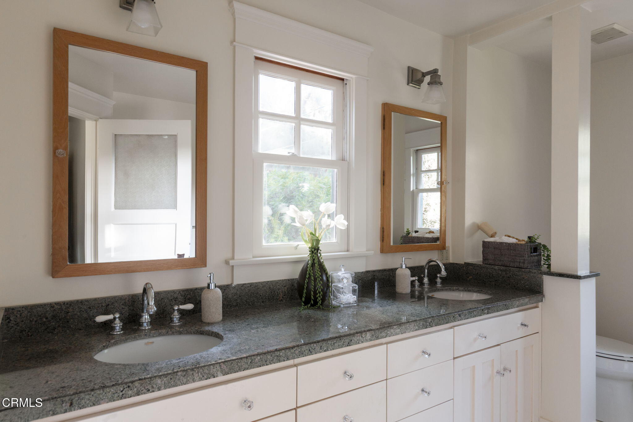 1813 Wayne Avenue South Pasadena, CA 91030 - Photo 36 of 56 a bathroom with double vanity sinks a mirror and a window