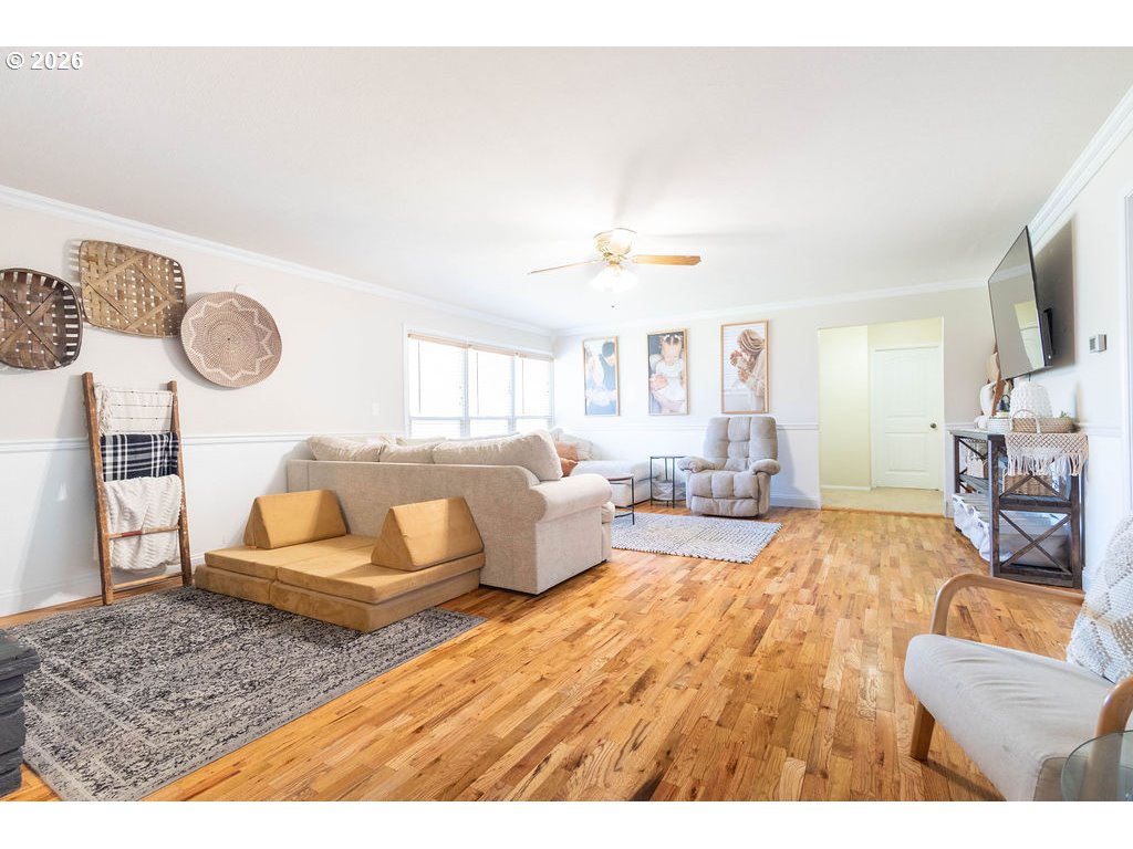 2703 North Spruce Street La Grande, OR 97850 - Photo 11 of 37 a living room with furniture and a wooden floor