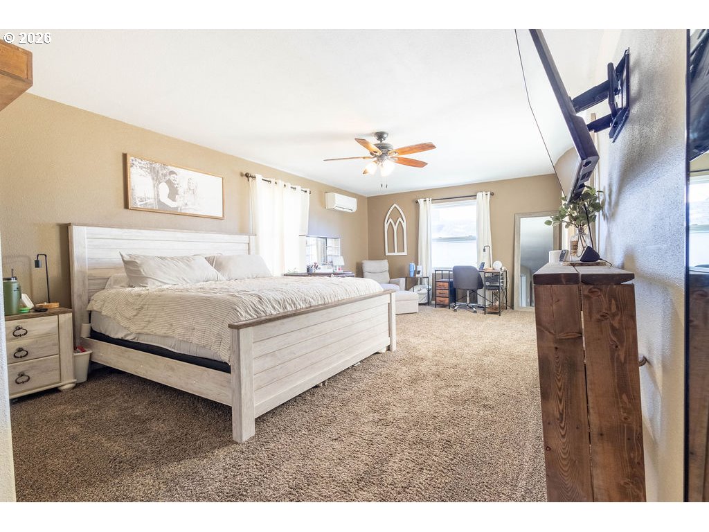 2703 North Spruce Street La Grande, OR 97850 - Photo 20 of 37 a bedroom with a bed and a chandelier