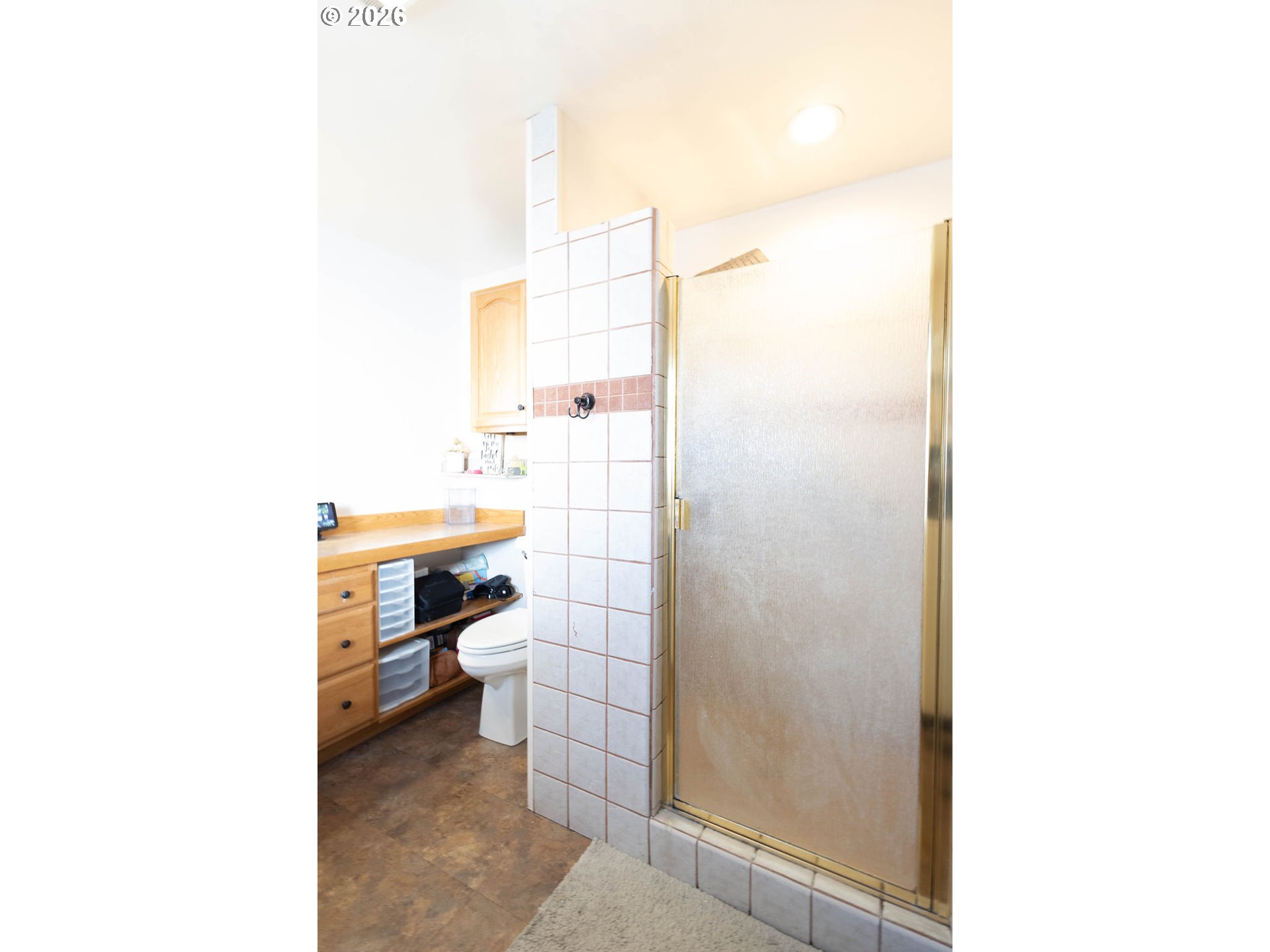 2703 North Spruce Street La Grande, OR 97850 - Photo 24 of 37 a bathroom with a sink a toilet and shower