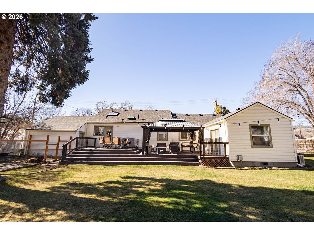 2703 North Spruce Street La Grande, OR 97850 - Photo 26 of 37 a view of a swimming pool with an outdoor seating
