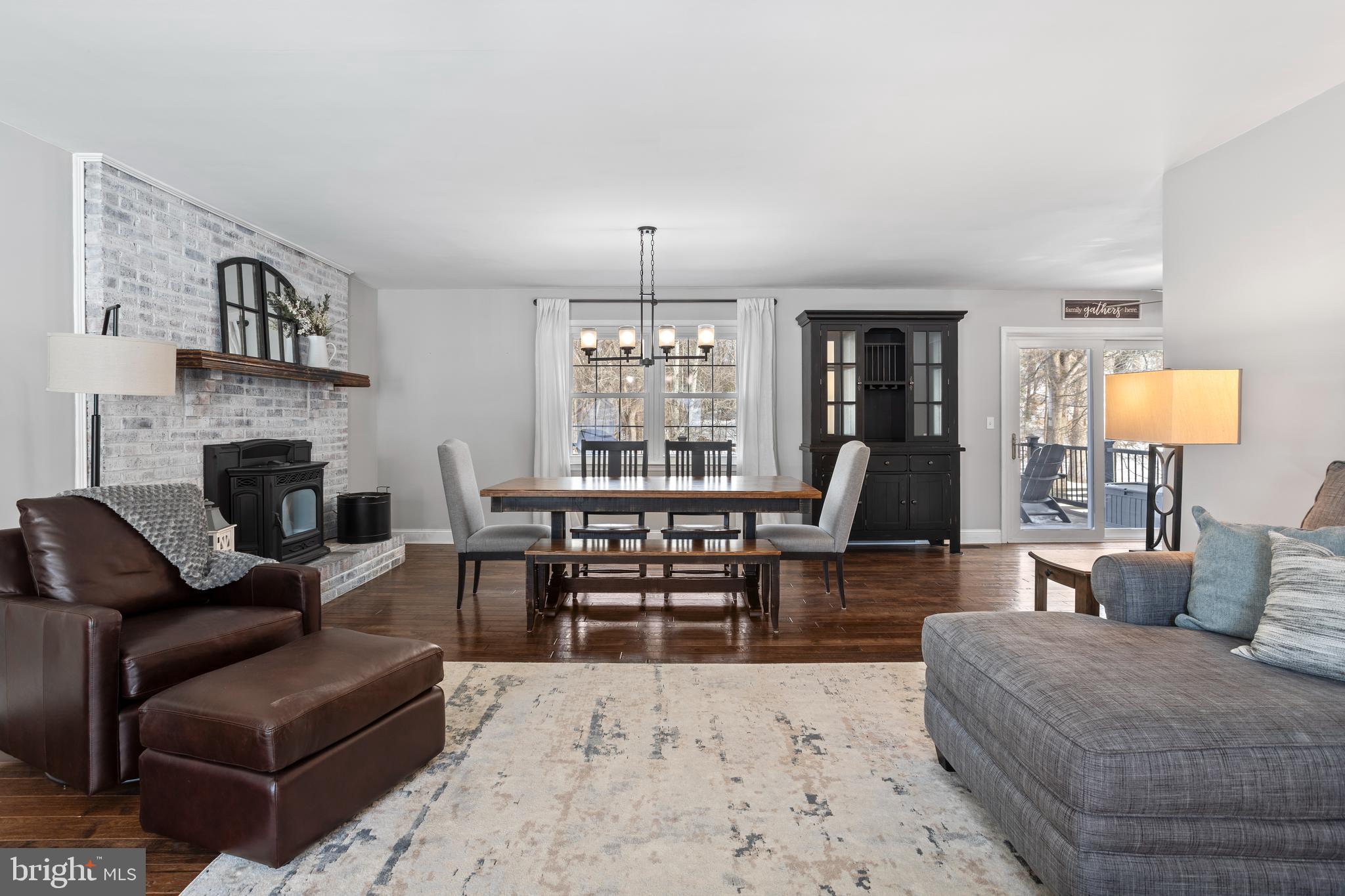 7955 Arbor Way Owings, MD 20736 - Photo 13 of 83 a living room with furniture a fireplace and a flat screen tv
