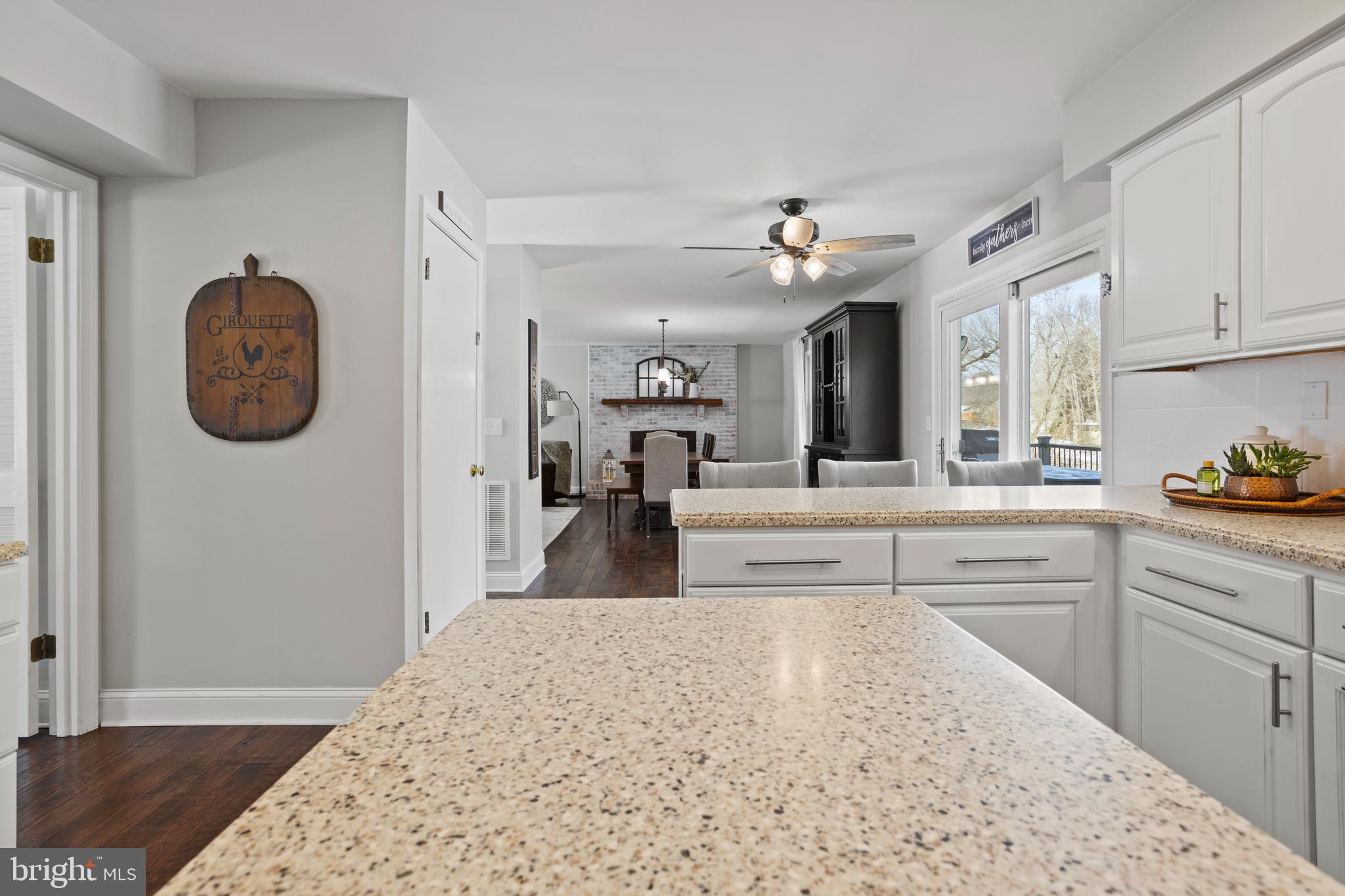7955 Arbor Way Owings, MD 20736 - Photo 18 of 83 a kitchen with kitchen island a counter top space and a view of living room