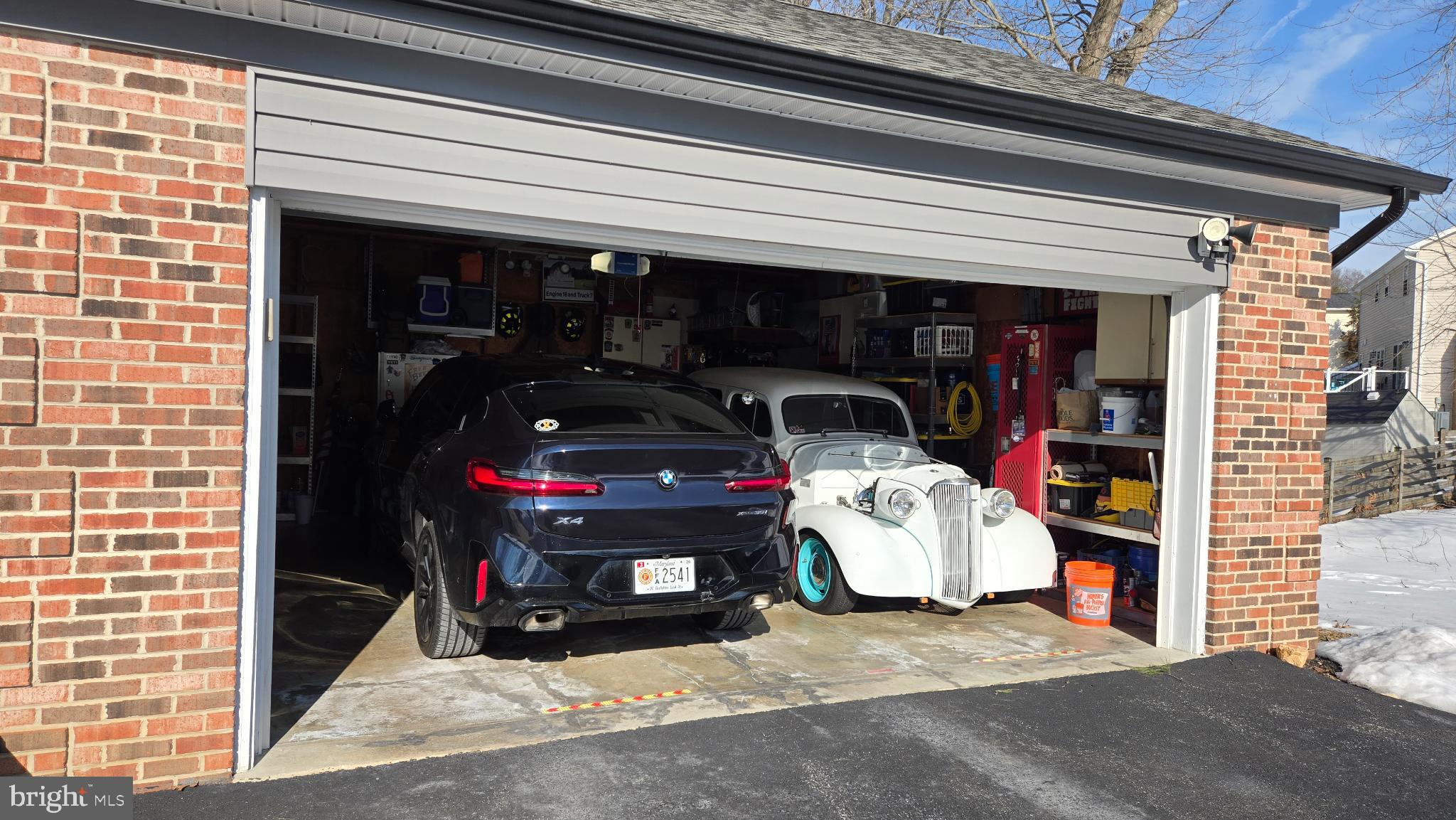 7955 Arbor Way Owings, MD 20736 - Photo 83 of 83 Classic and modern cars in a cozy garage.