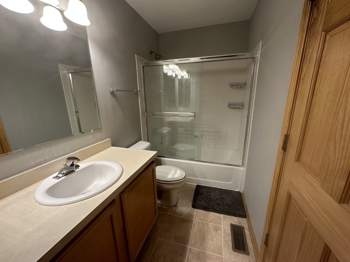 2598 Capitol Avenue Aurora, IL 60503 - Photo 7 of 11 a bathroom with a sink and a mirror
