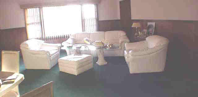 1003 North Alpine Road Rockford, IL 61107 - Photo 2 of 4 a living room with furniture and a window