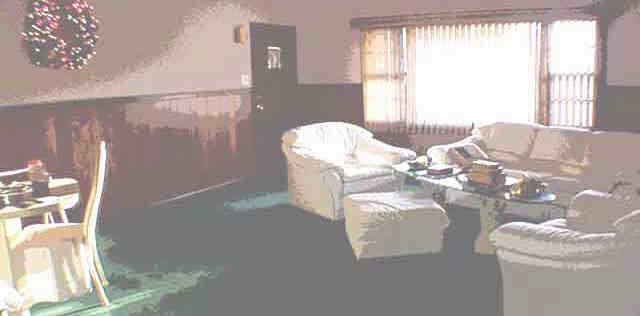 1003 North Alpine Road Rockford, IL 61107 - Photo 3 of 4 a living room with furniture and a large window
