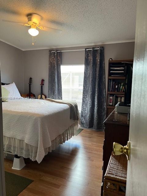 Martin County Stuart, FL 34997 - Photo 11 of 20 a bedroom with a bed and wooden floor