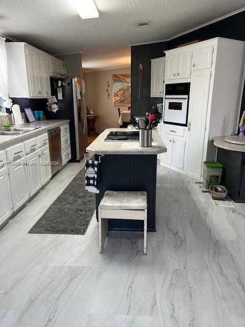 Martin County Stuart, FL 34997 - Photo 4 of 20 a living room with furniture a flat screen tv and a fireplace