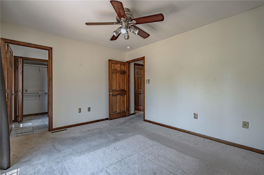 652 Old State Road Oley, PA 19547 - Photo 33 of 54 A comfortable bedroom features plush carpeting, a closet, and a ceiling fan for year-round comfort.