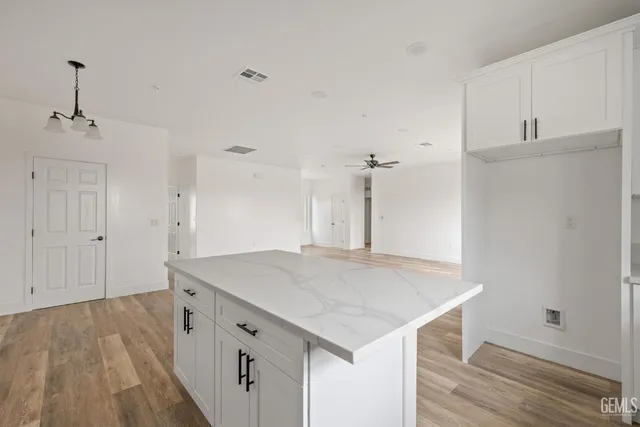 a kitchen with a sink and cabinets