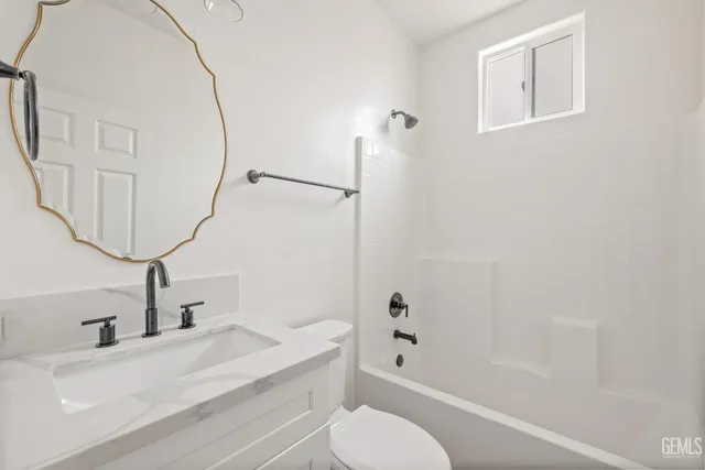 a bathroom with a sink a toilet and a bathtub