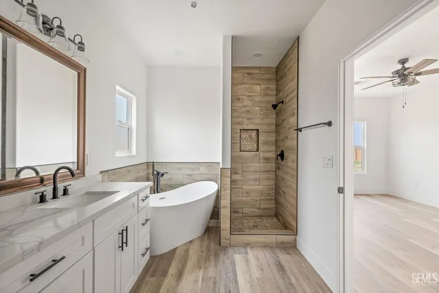 a bathroom with a double vanity sink a mirror and a