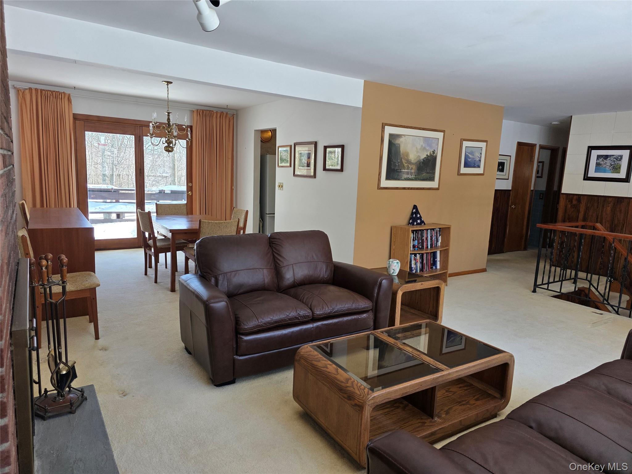 94 Whangtown Road Carmel, NY 10512 - Photo 4 of 12 Living room with view of dining area with sliders to deck.