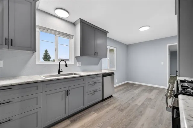 a spacious bathroom with a double vanity sink and mirror