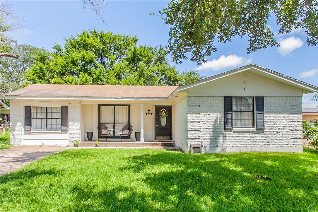 front view of a house with a yard