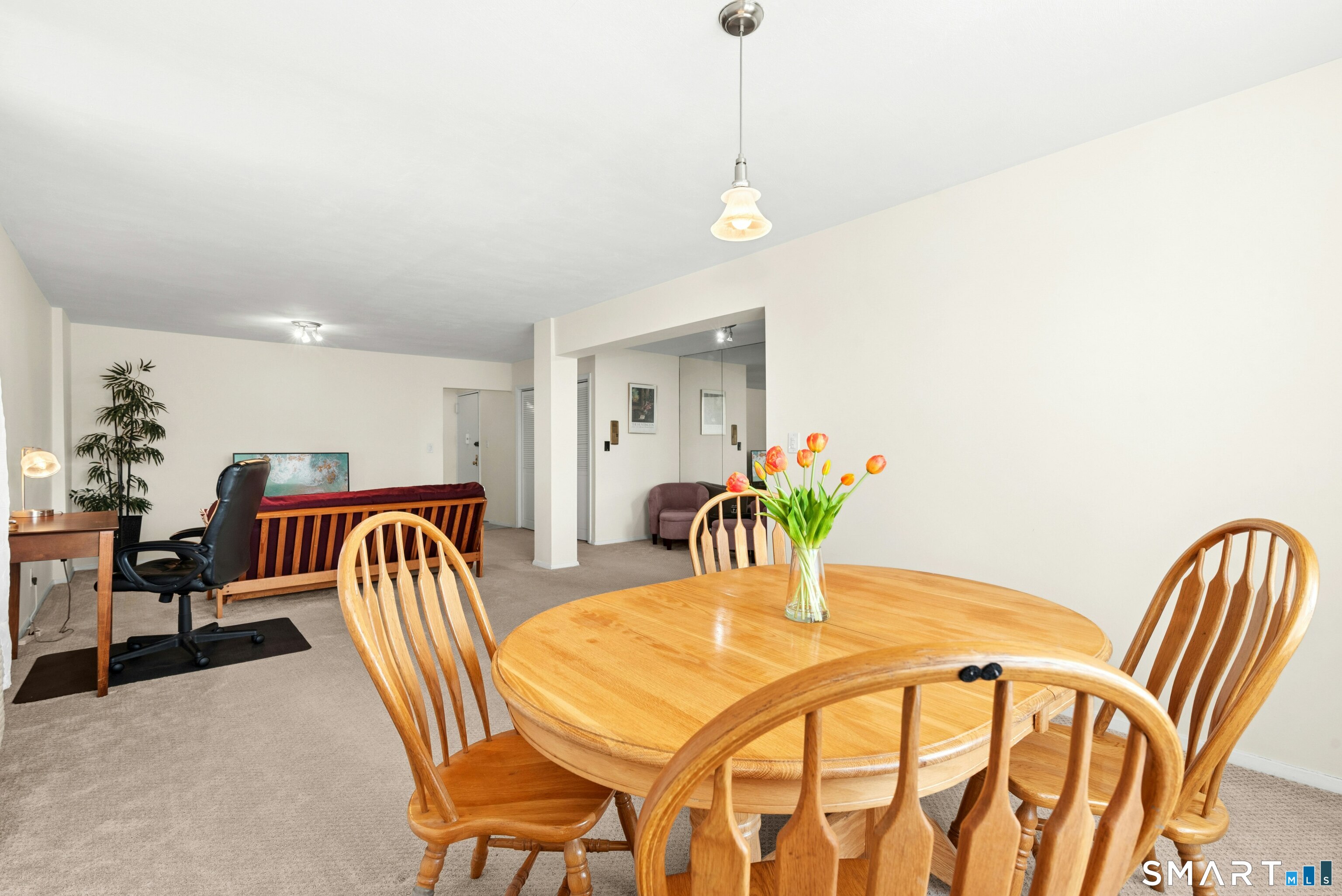 7 4th Street, Unit 3C Stamford, CT 06905 - Photo 12 of 21 a dining room with furniture and wooden floor