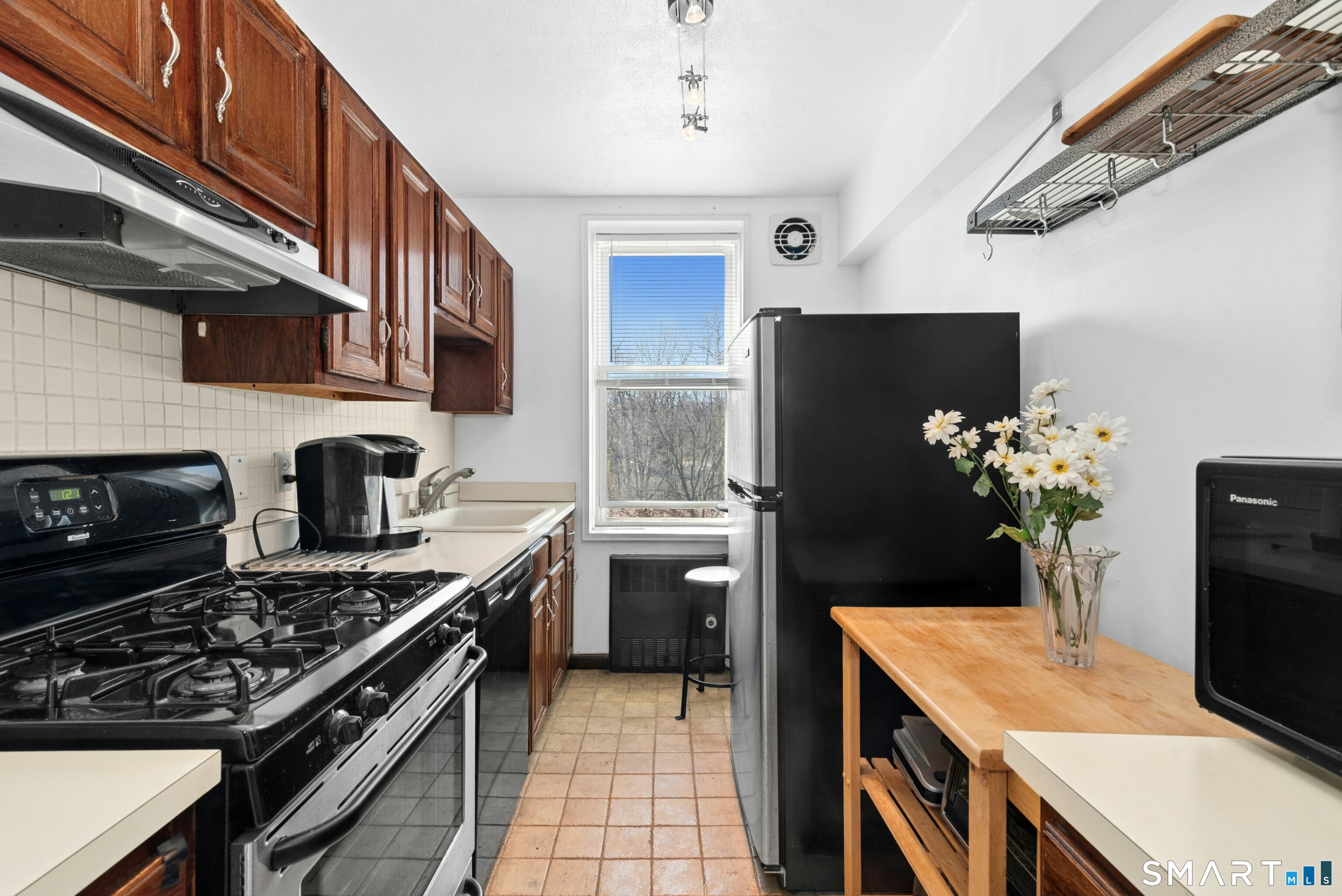7 4th Street, Unit 3C Stamford, CT 06905 - Photo 13 of 21 a kitchen with stainless steel appliances granite countertop a stove a sink dishwasher and a refrigerator
