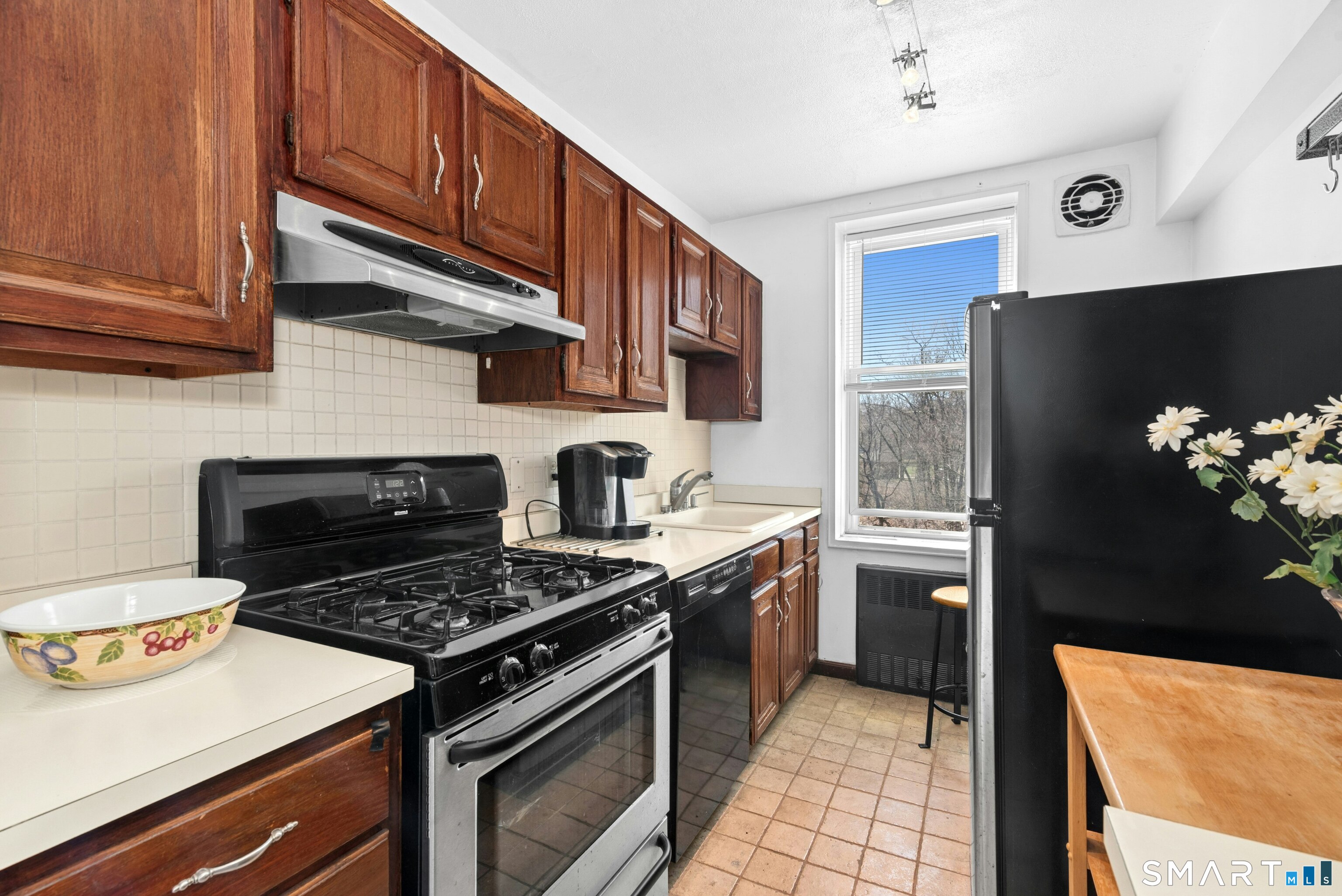 7 4th Street, Unit 3C Stamford, CT 06905 - Photo 14 of 21 a kitchen with stainless steel appliances granite countertop a stove a refrigerator and a stove