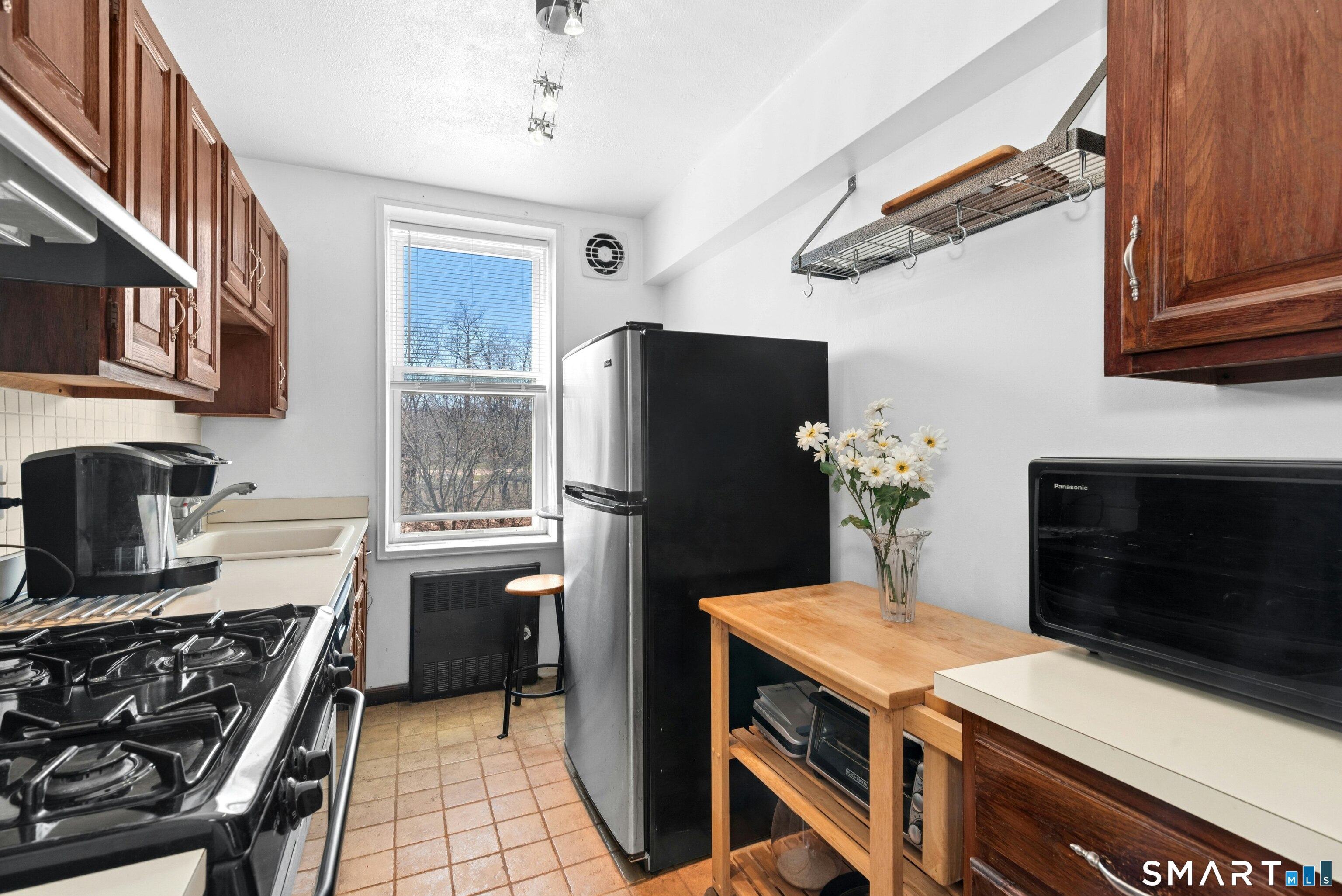 7 4th Street, Unit 3C Stamford, CT 06905 - Photo 15 of 21 a kitchen with stainless steel appliances a stove and a refrigerator