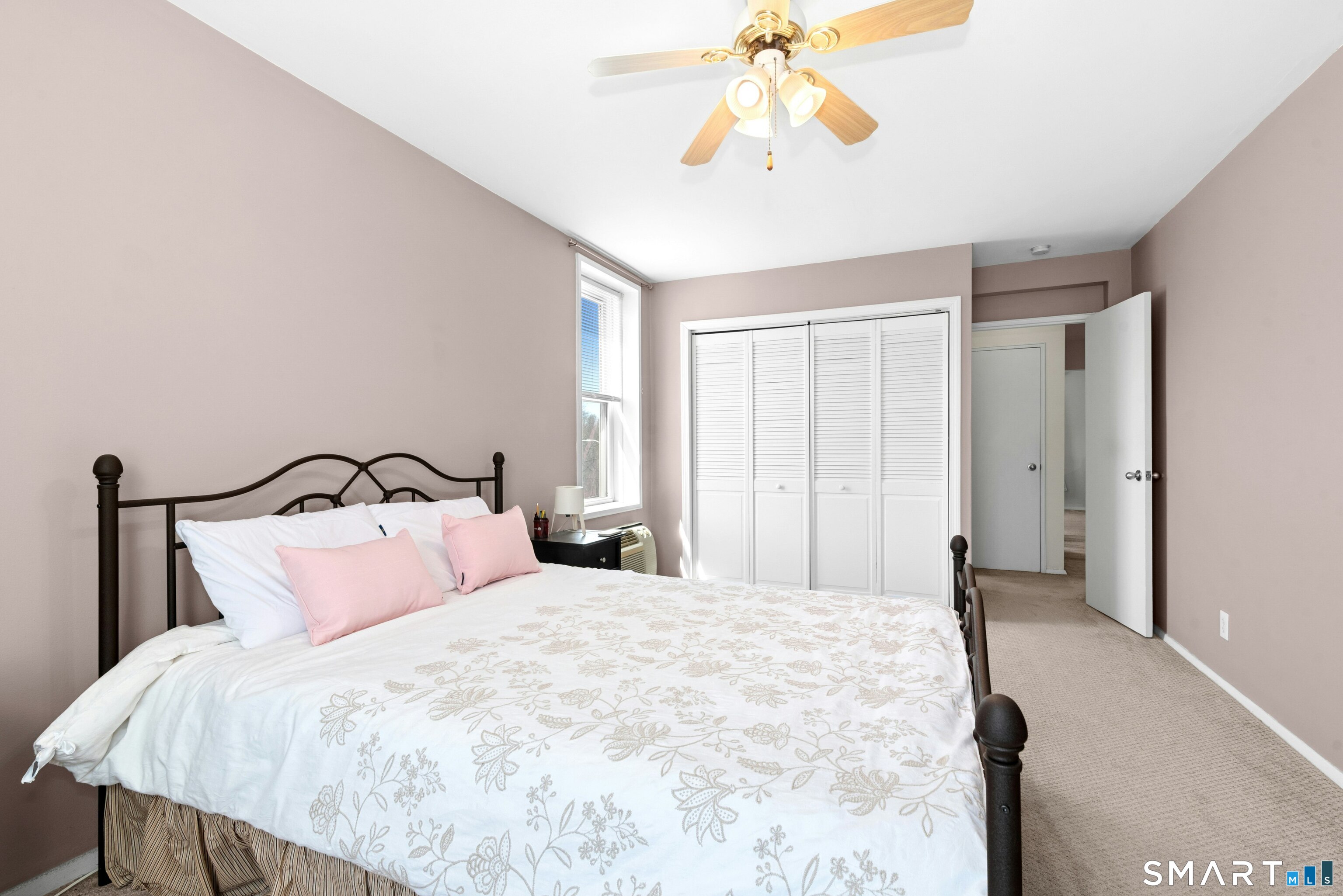7 4th Street, Unit 3C Stamford, CT 06905 - Photo 17 of 21 a bedroom with a bed and a chandelier