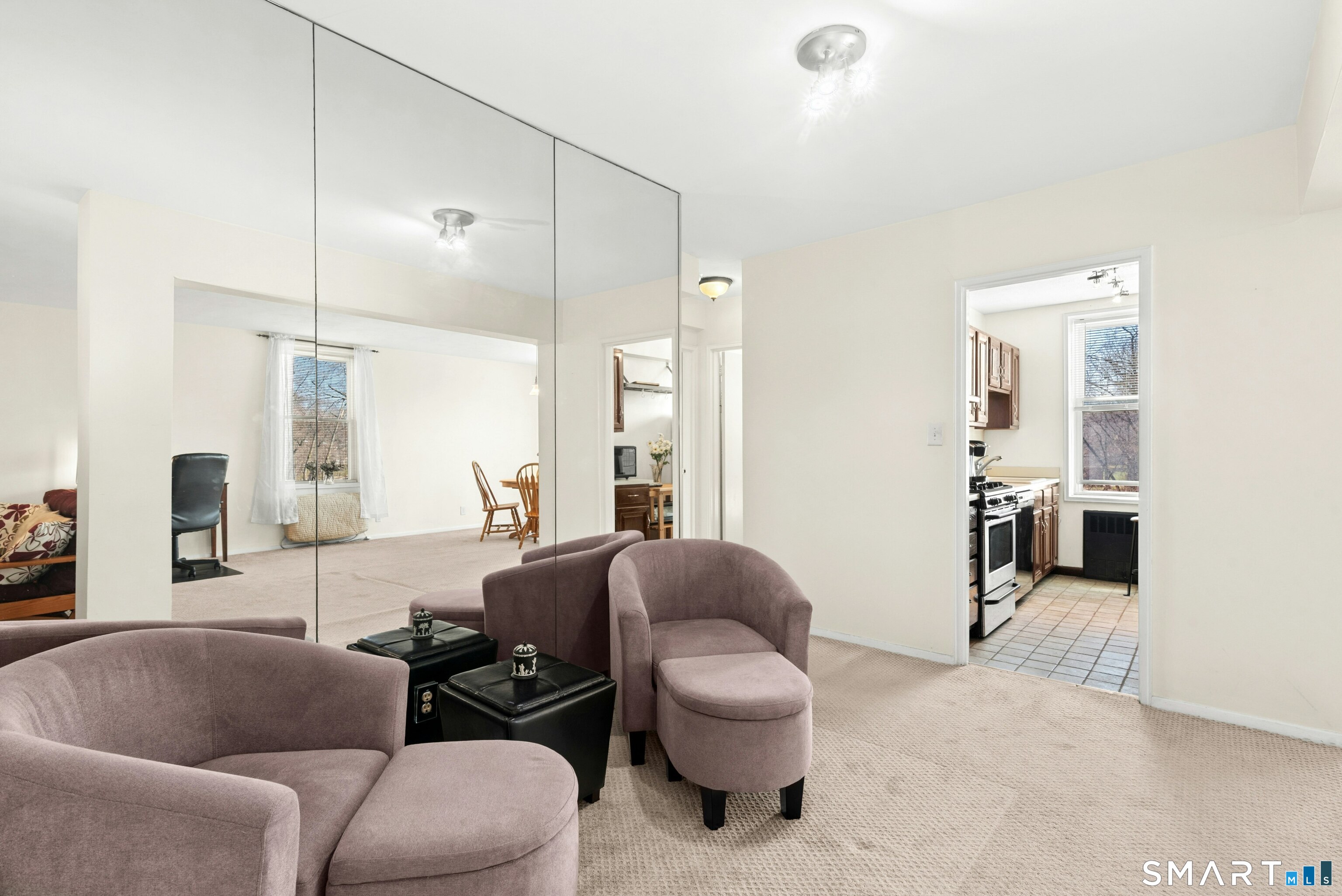 7 4th Street, Unit 3C Stamford, CT 06905 - Photo 5 of 21 a living room with furniture and a large window