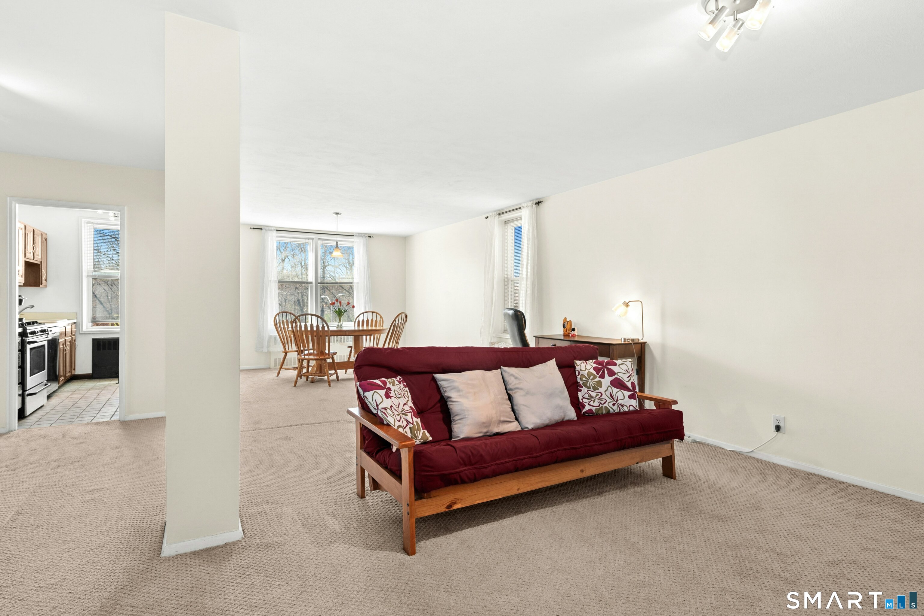 7 4th Street, Unit 3C Stamford, CT 06905 - Photo 7 of 21 a spacious bedroom with a bed and a night stand