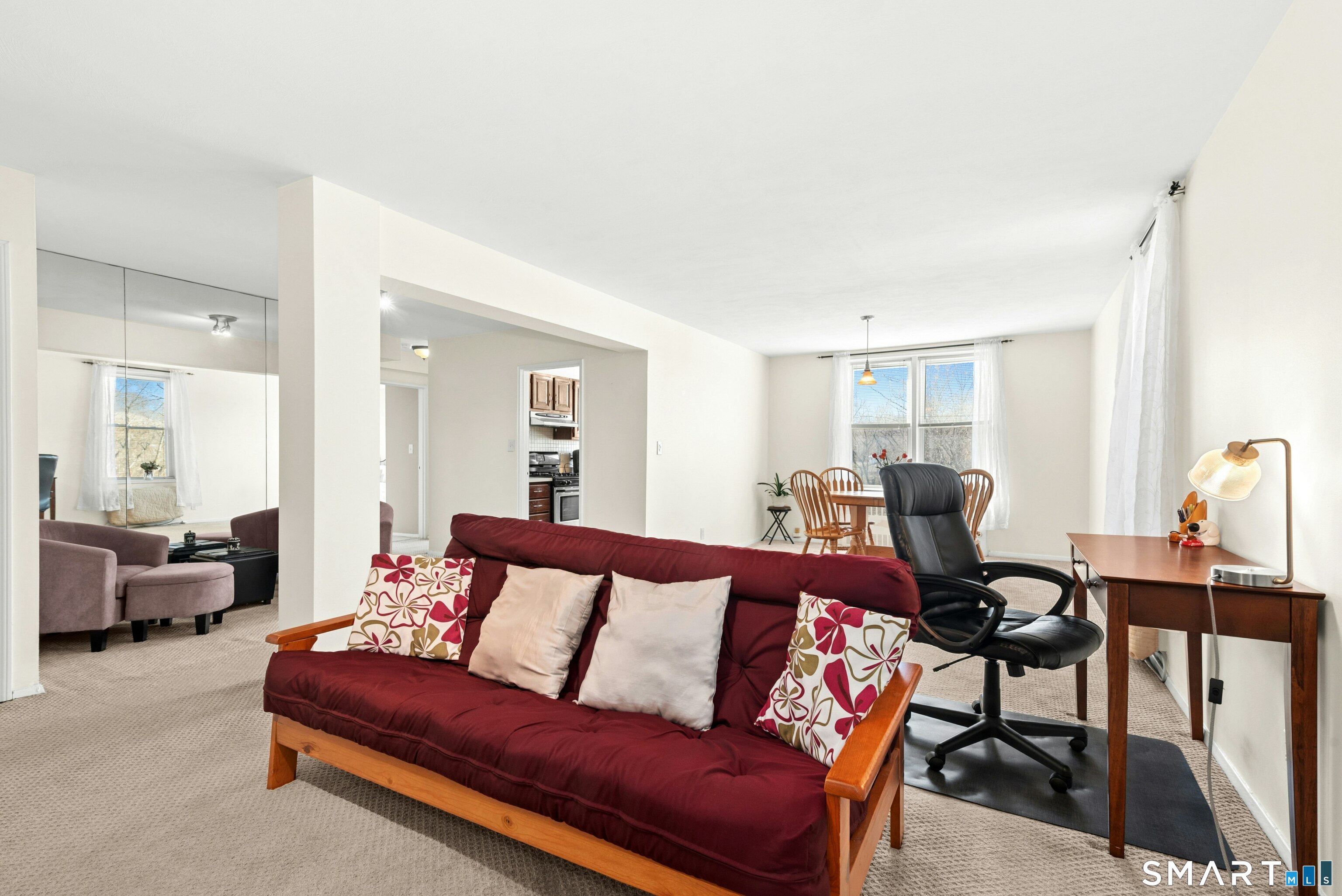 7 4th Street, Unit 3C Stamford, CT 06905 - Photo 8 of 21 a living room with furniture and a window