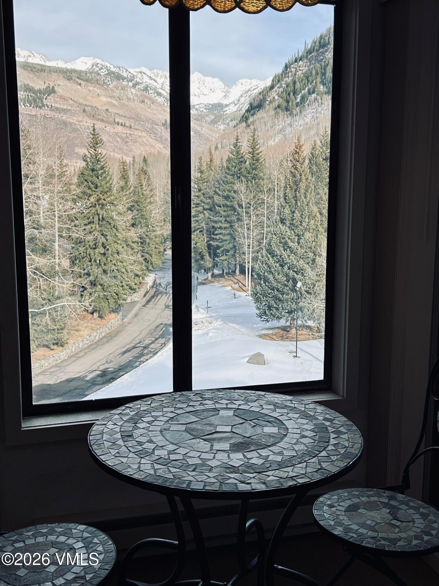 1650 Fall Ridge Road, Unit 413 Vail, CO 81657 - Photo 2 of 3 a view of a room with furniture and window