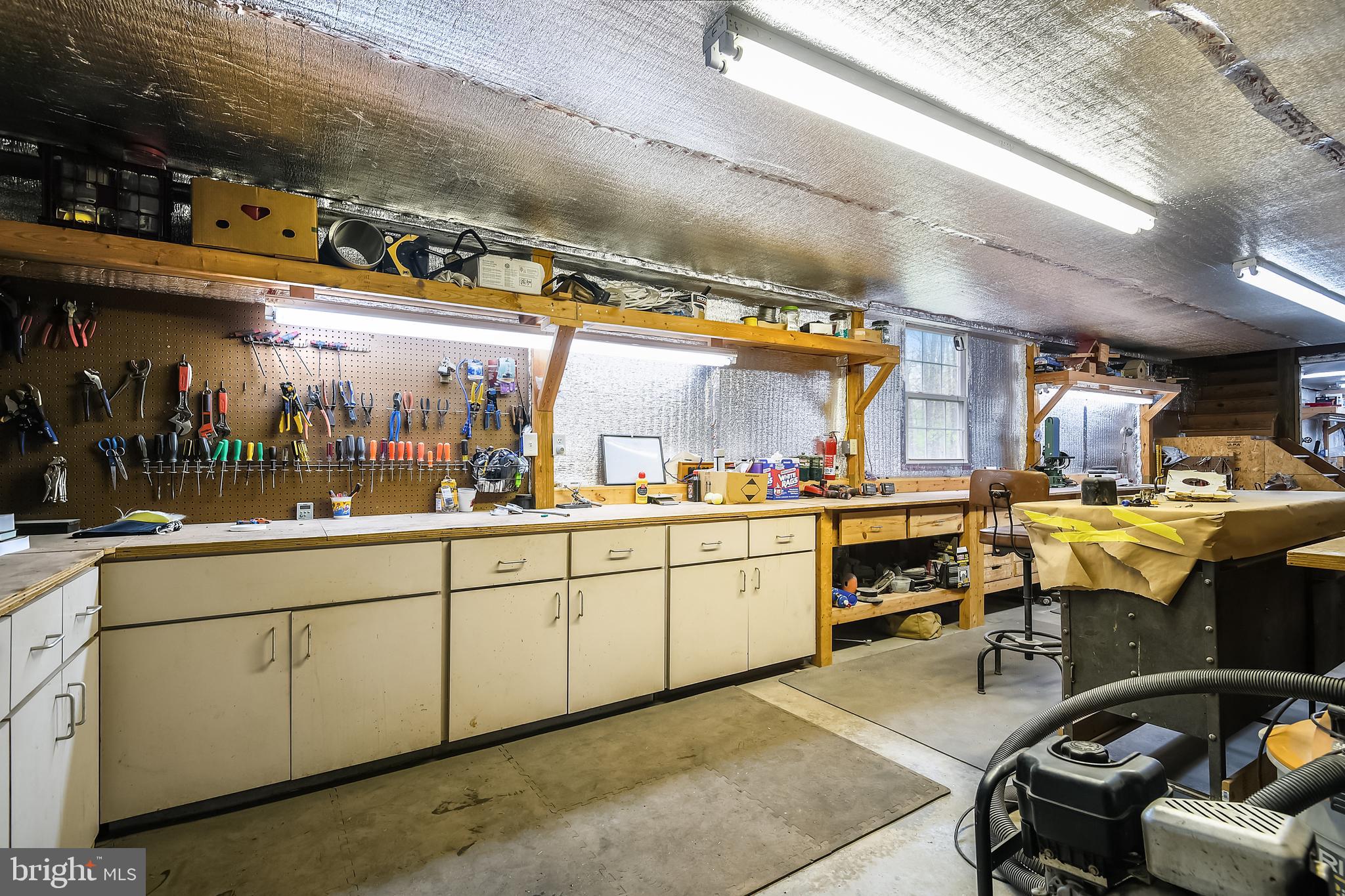 3285 Bert Koontz Road Taneytown, MD 21787 - Photo 65 of 78 Built-in workbenches along wall
