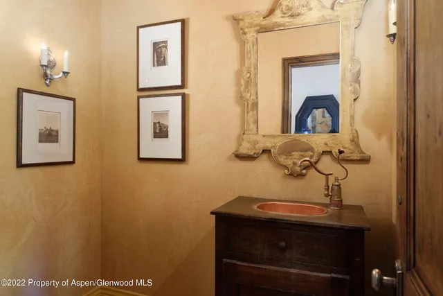 a bathroom with a sink and mirror