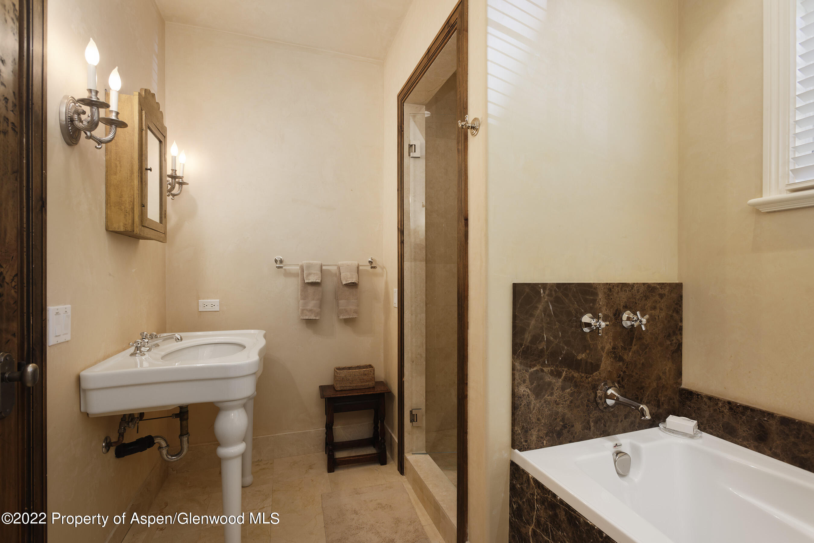 333 Snowmass Creek Road Snowmass, CO 81654 - Photo 15 of 41 a bathroom with a sink a toilet and shower