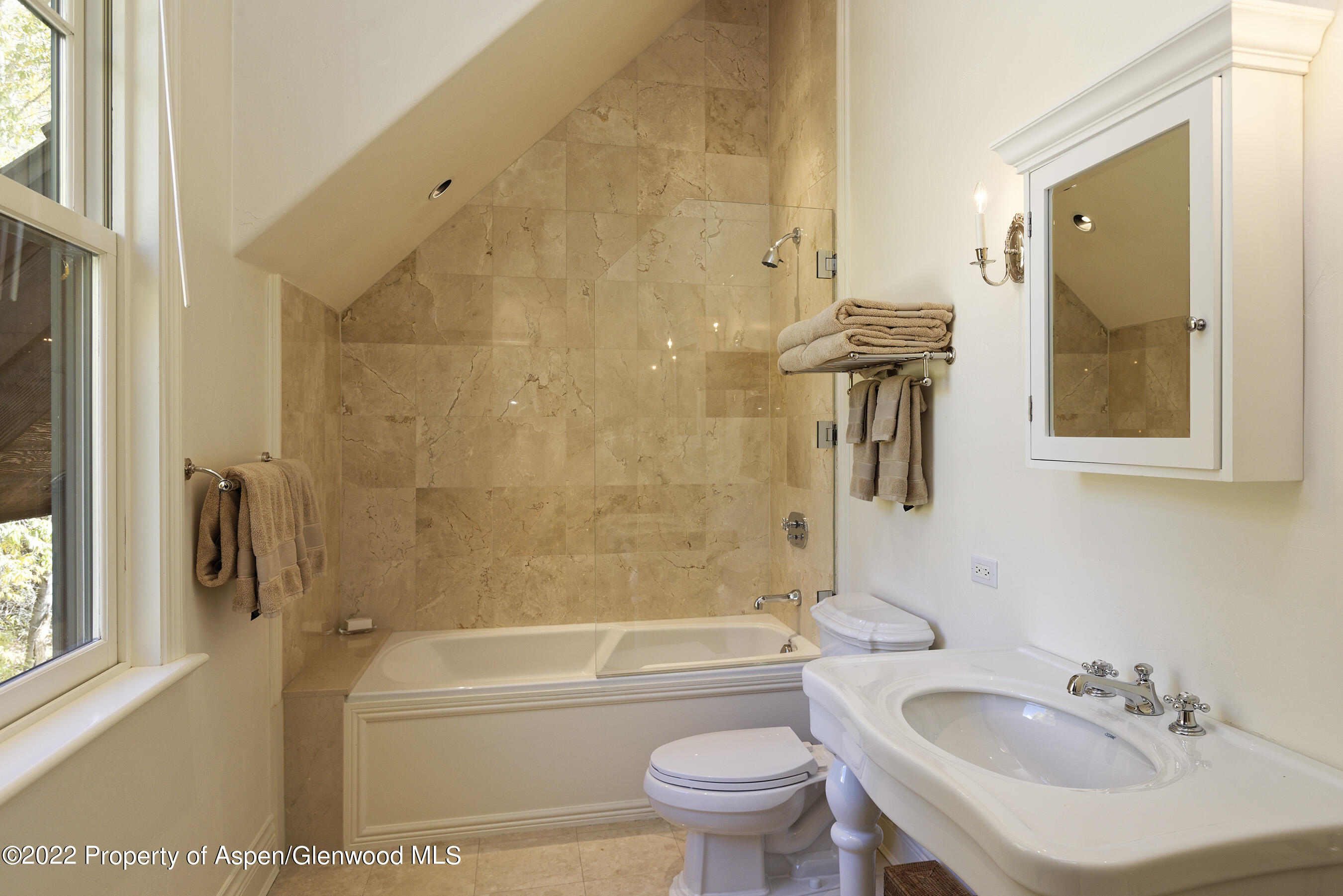 333 Snowmass Creek Road Snowmass, CO 81654 - Photo 21 of 41 a bathroom with a sink toilet and shower